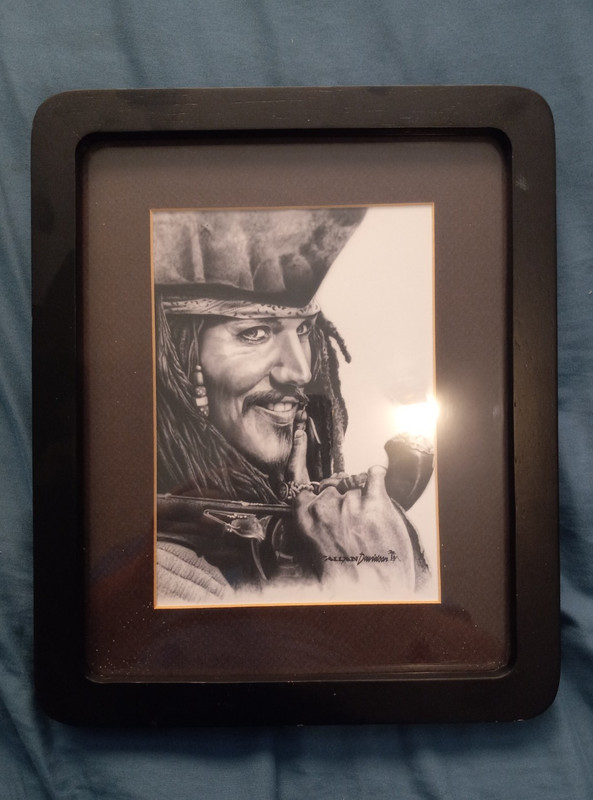 Pirates of the Caribbean Captain Jack Sparrow art with black frame sighed