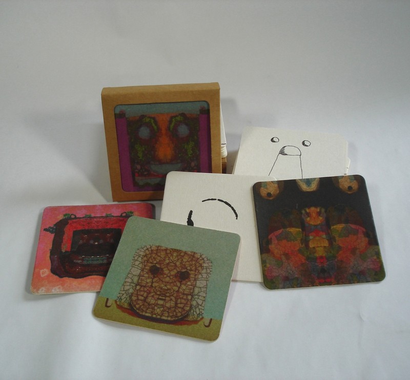 a set of 8 thick, printed, paper, absorbent, beverage coasters + 1 drawing