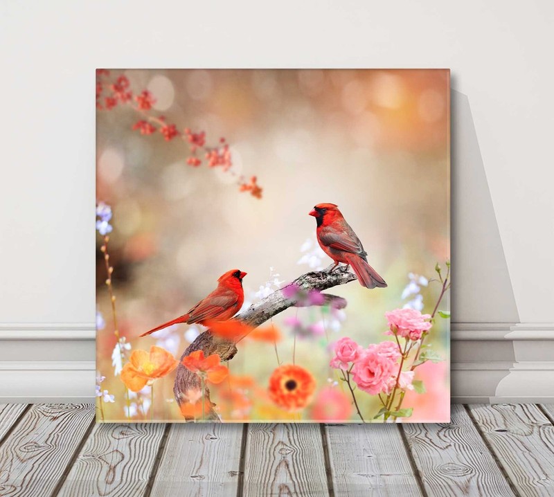 Birds and flowers. Colourful birds perched on a branch. Canvas picture print.
