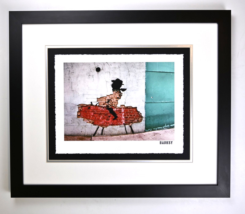 «Urban Cowboy» by Banksy, Framed Art