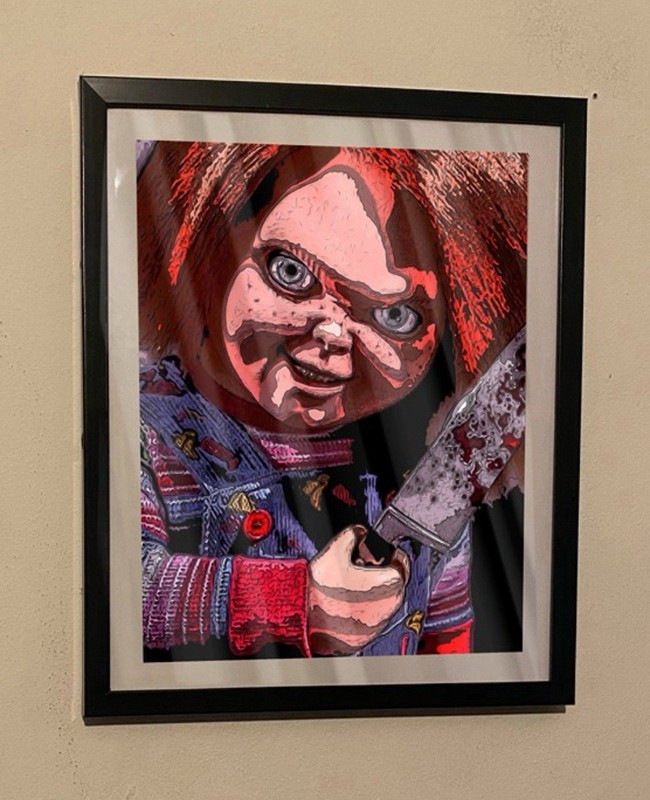 custom art piece of chucky from childs play on black frame